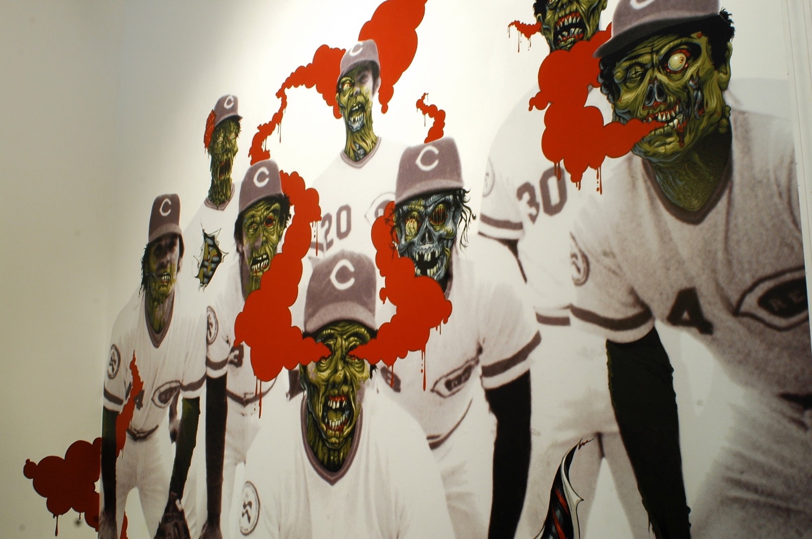 Artwork inside the store featuring vintage Cincinnati Reds players reimagined with graffiti-style zombie faces.